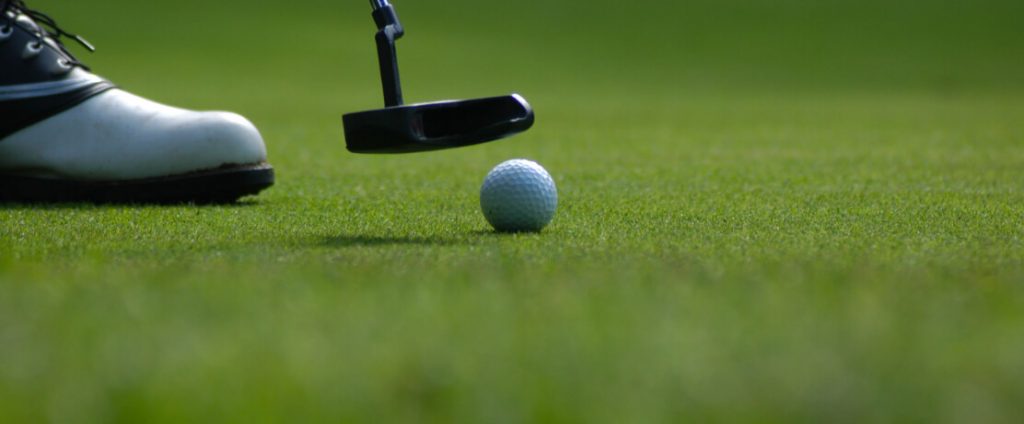 Golf ball on the green, putting in scotland