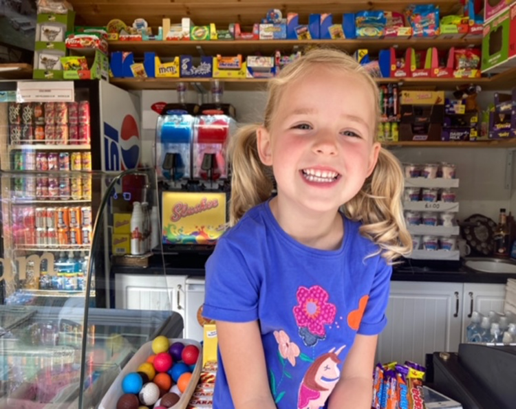 Child choosing sweets at inverness crazy golf sweet shop